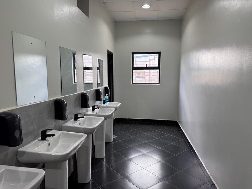 Staff washroom with basins and mirrors