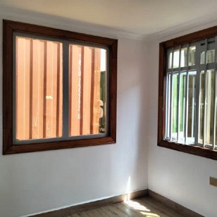 Finished modular room with timber-framed windows