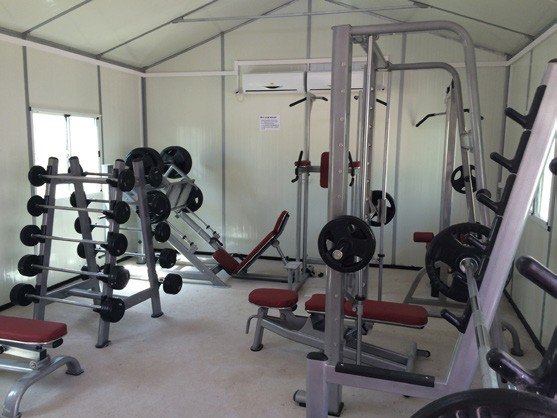 Camp gym with weights and training rack