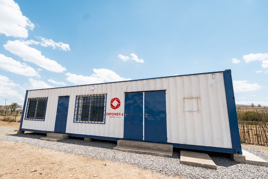 Container clinic with blue doors and window grilles