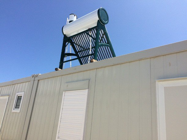 Solar water heater mounted on a camp unit