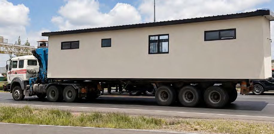 Finished module loaded on a truck, ready for transport and installation