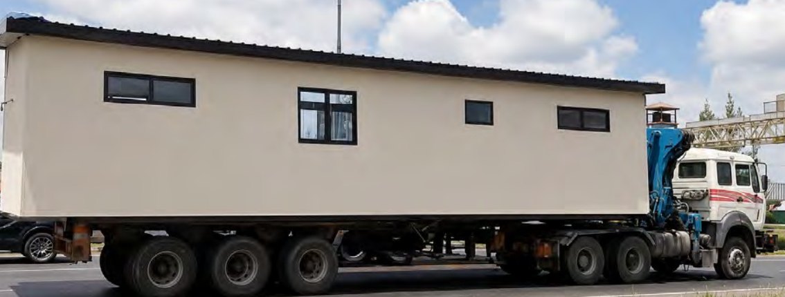 Finished module loaded on a truck, ready for transport and installation