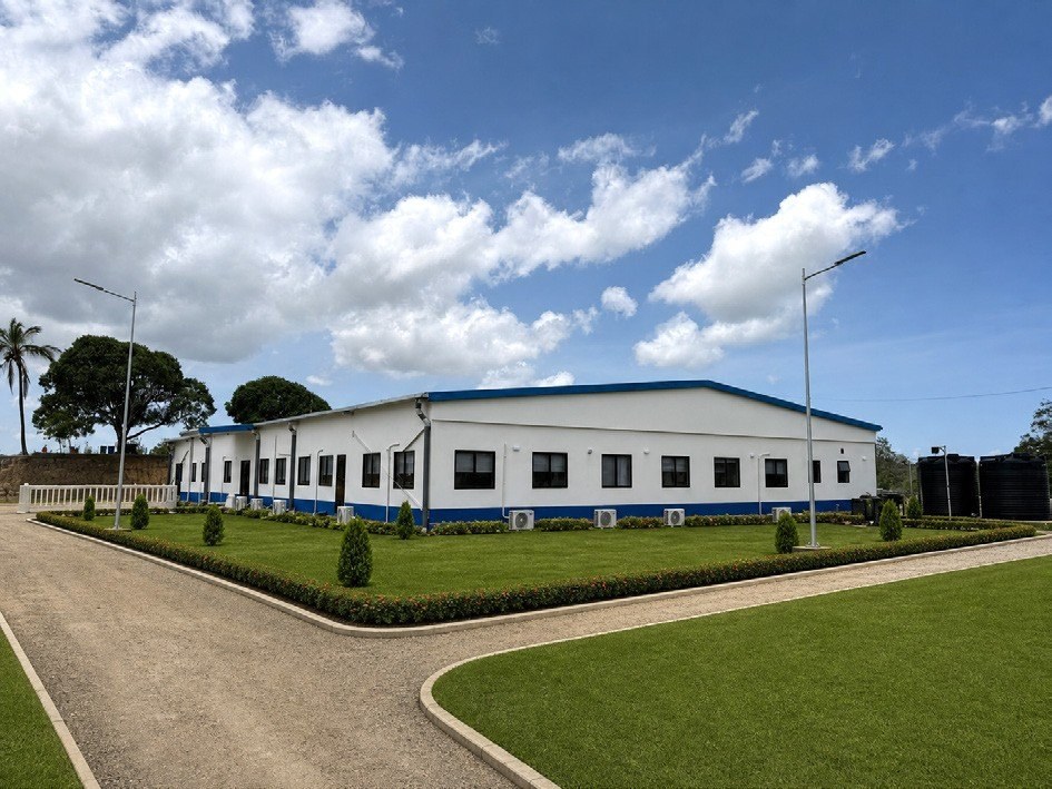 Completed steel-structure building at Dongo Kundu with landscaped approach